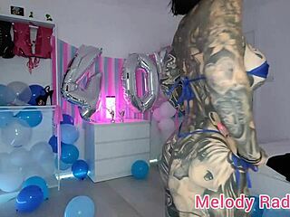 Tattooed beauty Melody radford tries on a pink and blue micro bikini