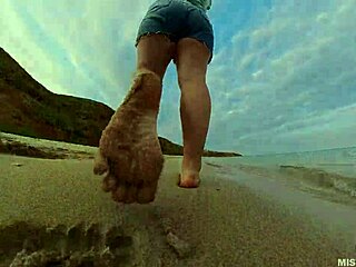 Explore the sandy shores with my bare feet